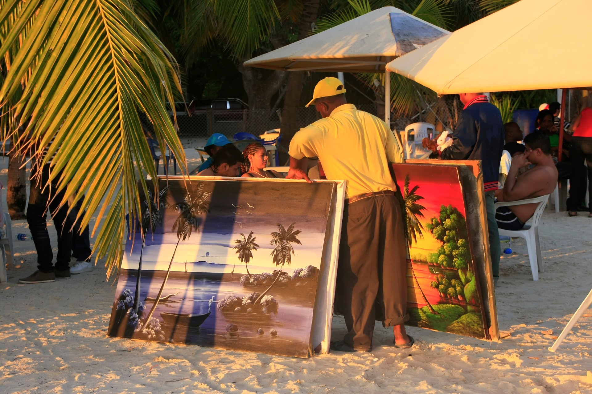 Local man selling paintings at Boca Chica beach